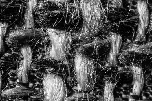 Texture of cloth material for design. Abstract background with white, black and gray threads of woven.