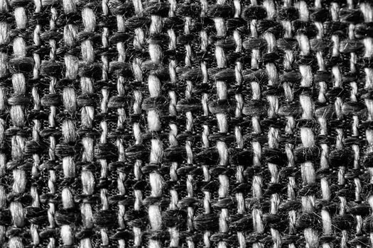 Texture of cloth material for design. Abstract background with white, black and gray threads of woven.