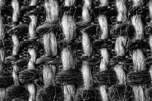 Texture of cloth material for design. Abstract background with white, black and gray threads of woven.