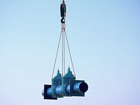 Crane is moving with new gate valve and 500 mm pipeline. Repairing of drink water pipeline system