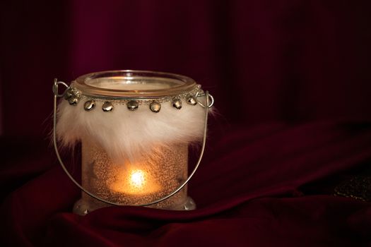 Christmas concept with red background and candles with copy space