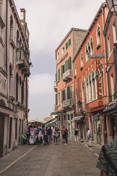 VENICE, ITALY 2 JULY 2020: Tourists walk in Venice street