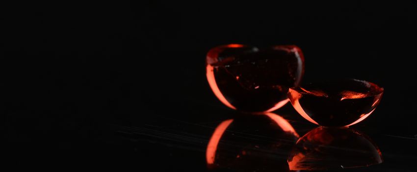 glowing red balls ob black background with reflection - concept shot. with copy space