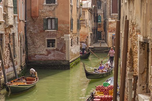 VENICE, ITALY 2 JULY 2020: Gondolier in Venice canal