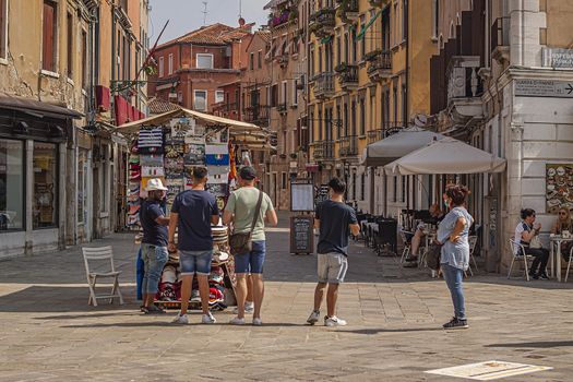 VENICE, ITALY 2 JULY 2020: Tourists walk in Venice street