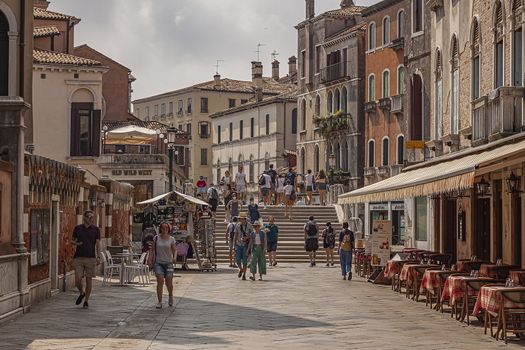 VENICE, ITALY 2 JULY 2020: Tourists walk in Venice street