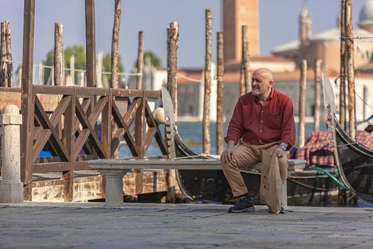 VENICE, ITALY 2 JULY 2020: Old man in Saint Mark square in Venice