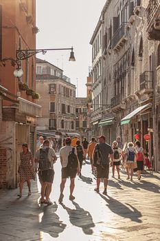 VENICE, ITALY 2 JULY 2020: Tourists walk in Venice street