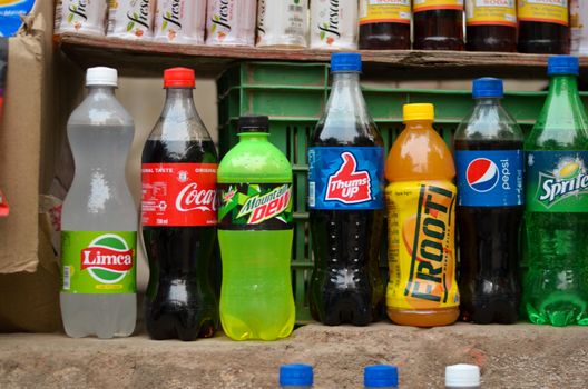 New Delhi, India, 2020. Cold drink brands kept for display at a roadside vendor shop during summers. Soft drink sales go up during this season global companies like Pepsi, Coca Cola, Thumbs up, Frooti