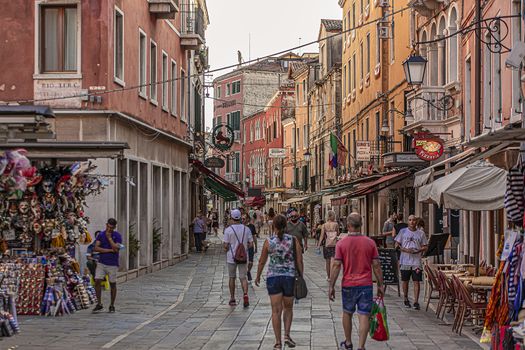 VENICE, ITALY 2 JULY 2020: Tourists walk in Venice street