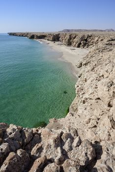 Top view from cliff of a wild beach at the coat of Ras Al Jinz, Sultanate of Oman.