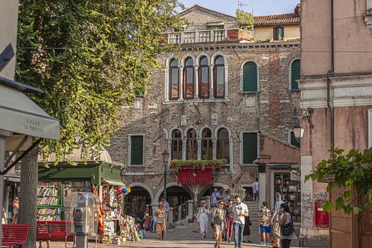 VENICE, ITALY 2 JULY 2020: Tourists walk in Venice street