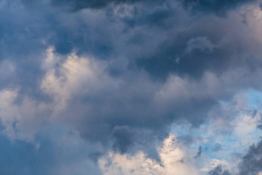 evening summer clouds background in different contrast shades.