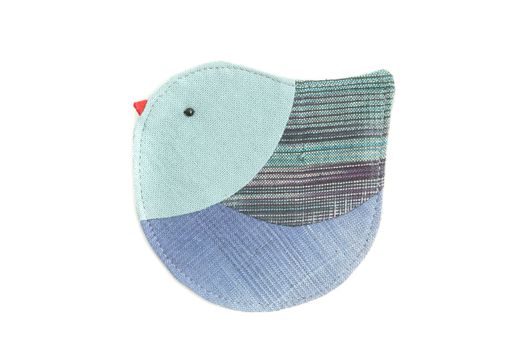 cute bird sew by cloth isolated on a white background