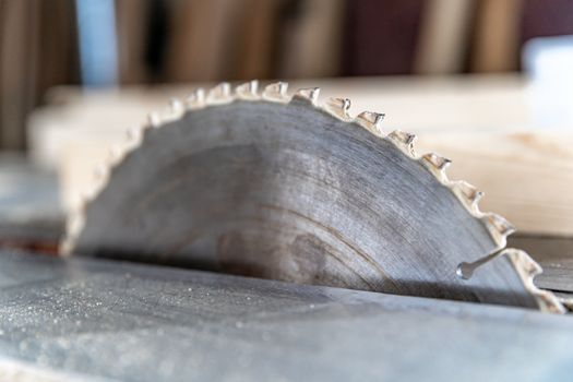 toothed metal blade on circular saw in joinery.