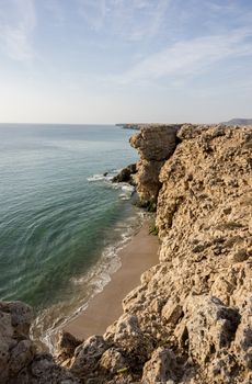 View over cliffs  and Gulf of Oman at the wild coast of Ras Al Jinz, Sultantae of Oman