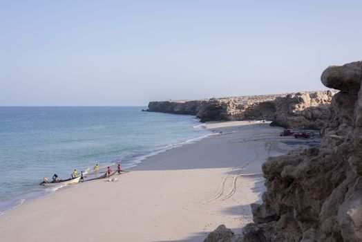 Fishermen pulling their net on the beach of Ras Al Jinz, Oman