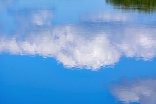 Reflection of the cloud in the lake