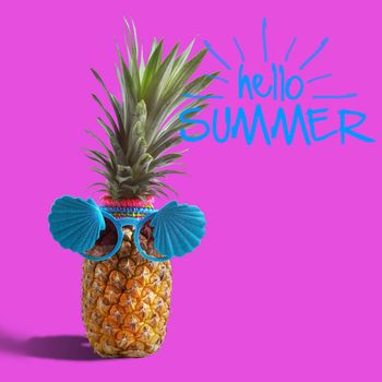 Summer and Holiday concept.Hipster Pineapple Fashion Accessories and Fruits on blue and hello summer word background