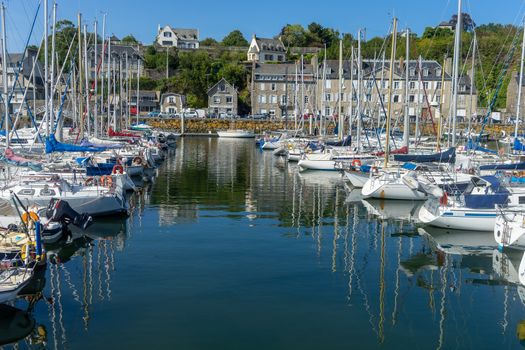 Sea and yachts during tide on sea shore of France in summer