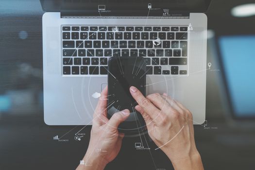 cyber security internet and networking concept.Businessman hand working with VR screen padlock icon mobile phone on computer background