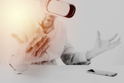 businessman wearing virtual reality goggles in modern office with Smartphone using with VR headset with metix code exposure