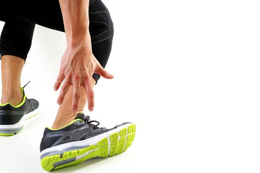 Runner sportsman holding ankle in pain with Broken twisted joint running sport injury and Athletic man touching foot due to sprain on white background