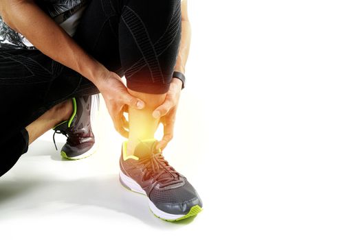 Runner sportsman holding ankle in pain with Broken twisted joint running sport injury and Athletic man touching foot due to sprain on white background