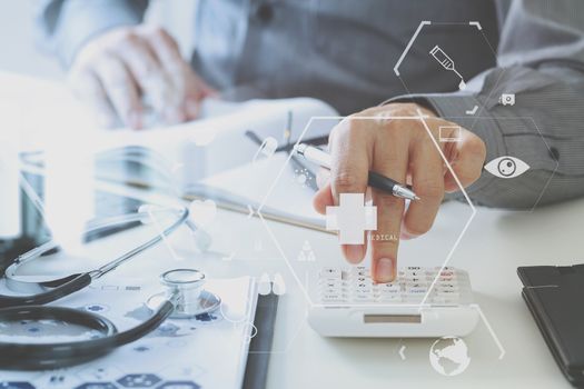 Healthcare costs and fees concept.Hand of smart doctor used a calculator for medical costs in modern hospital with VR icon diagram