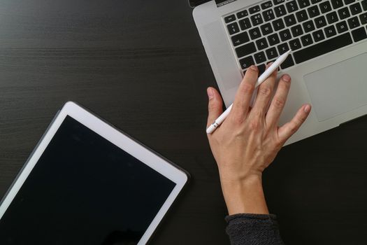 cyber security internet and networking concept.Businessman hand working with laptop computer and digital tablet