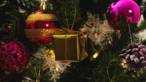 Greeting Season concept.close up of ornaments on a Christmas tree with decorative light