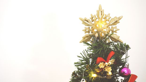 Greeting Season concept.close up of ornaments on a Christmas tree with decorative light