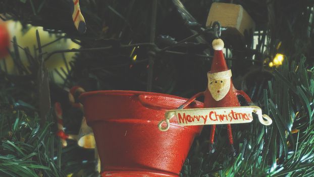 Greeting Season concept.close up of ornaments on a Christmas tree with decorative light