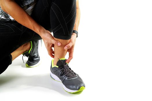 Runner sportsman holding ankle in pain with Broken twisted joint running sport injury and Athletic man touching foot due to sprain on white background