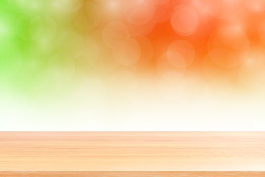 empty wood table floors on blurred bokeh soft orange white gradient background, wooden plank empty on bokeh colorful light shade, colorful bokeh lights gradient soft for banner advertising products