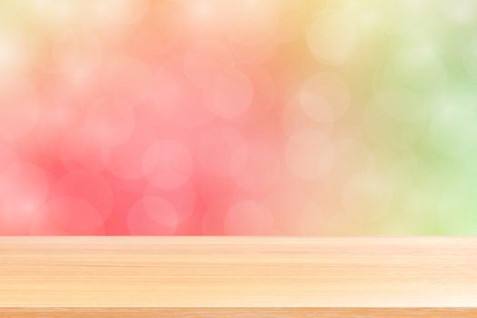 empty wood table floors on blurred bokeh soft pink gradient background, wooden plank empty on green pink bokeh colorful light shade, colorful bokeh lights gradient soft for banner advertising products