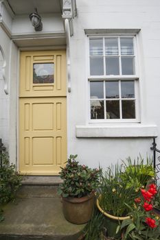 Old country cottage in english rural village with front door