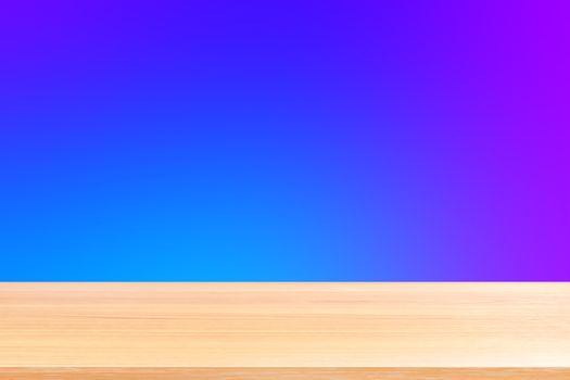 empty wood table floors on gradient blue and purple soft background, wood table board empty front colorful gradient, wooden plank blank on blue gradient for display products or banner advertising
