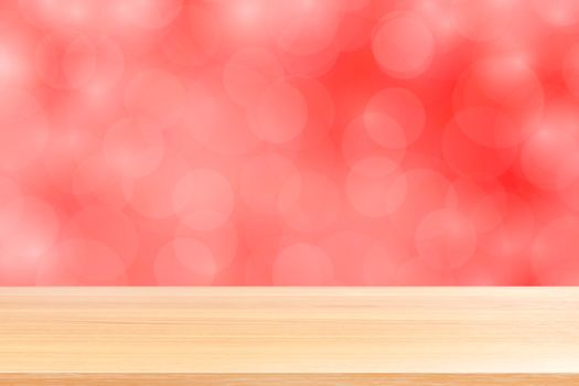 empty wood table floors on blurred bokeh soft red gradient background, wooden plank empty on red bokeh colorful light shade, colorful bokeh lights gradient soft for banner advertising products