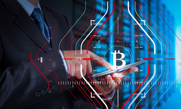 Businessman working with new modern computer and Bitcoin cryptocurry virtual diagram as concept.