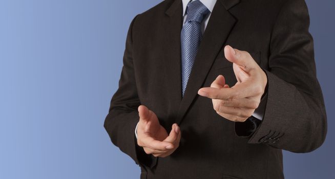 Businessman hand pressing an imaginary button on virtual screen