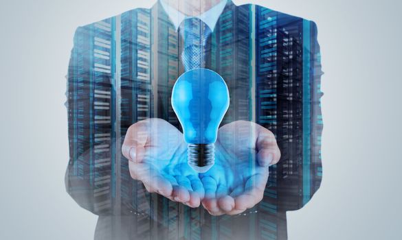 Double exposure of Businessman hand working with 3d light bulb of leadership concept 