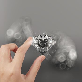 hand holding 3d diamond over grey background 
