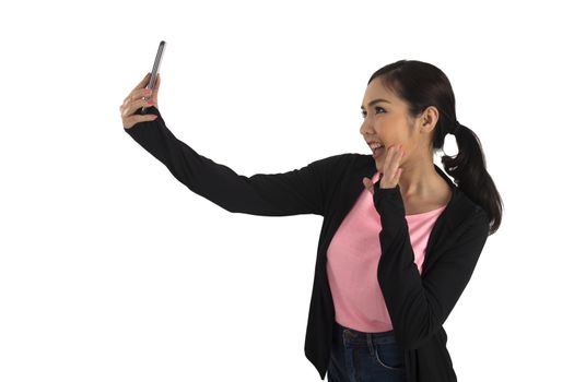 Cute asian girl in casual cloth holding mobile phone and take selfie on white background.