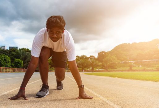 Asian young athlete sport runner black man wear feet shoe active ready to start running training at the outdoor on the treadmill for a step forward, healthy exercise workout, closeup face front