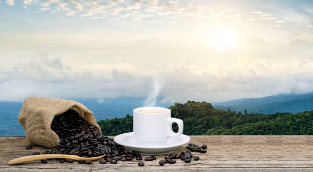 Morning coffee cup and Roasted coffee beans views with mountain sun