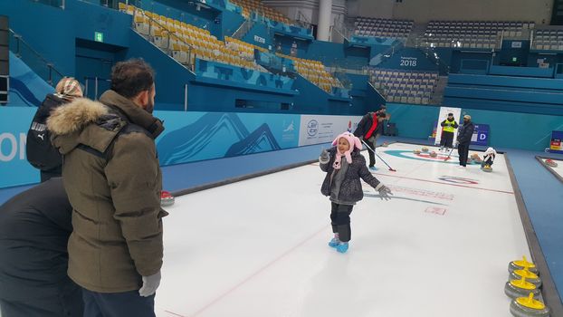 Pyeongchang, South Korea - Fbruary 09, 2019: People play in curling for recreation purpose, in ice arena during winter season.