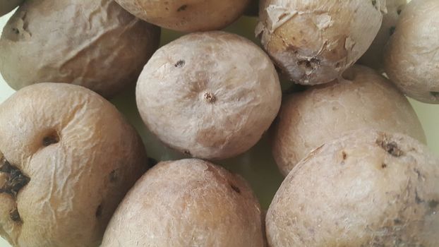  close up view of fresh organic potato in market:  Food background texture of raw potatoes