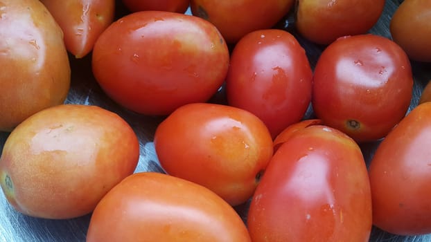Red tomatoes in super market for sale. A background for text and advertisements
