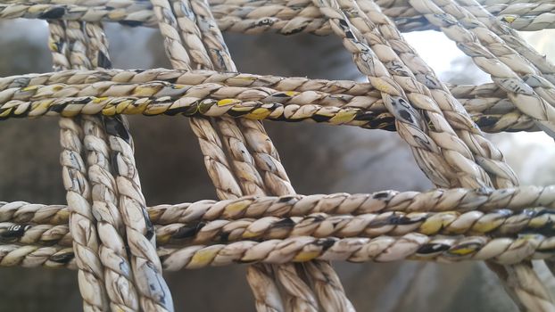 Closeup view of dried jute thread or ropes interwoven for making traditional old style bed called charpai